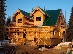 Angels Log Homes installation of metal roof system